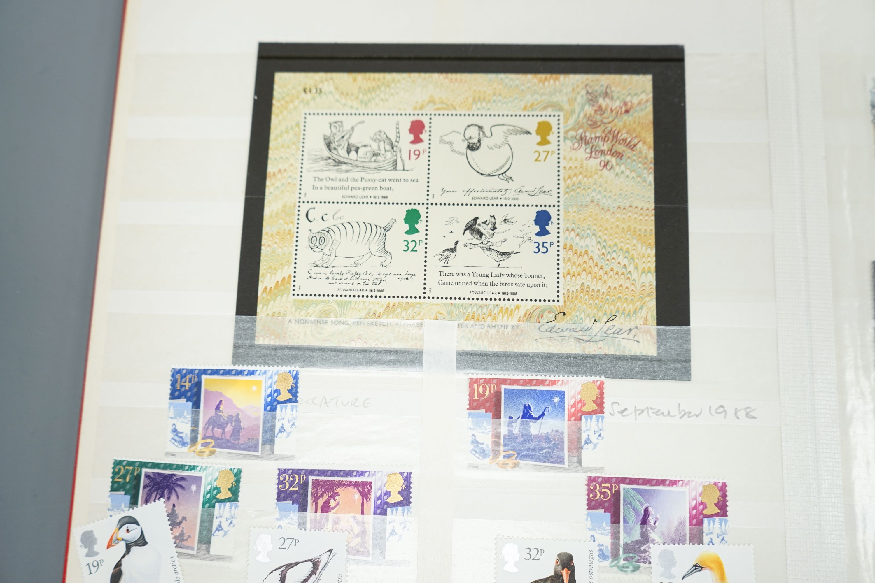 A blue album of George V mounted mint British Commonwealth stamps, one other album and two stock books (4)